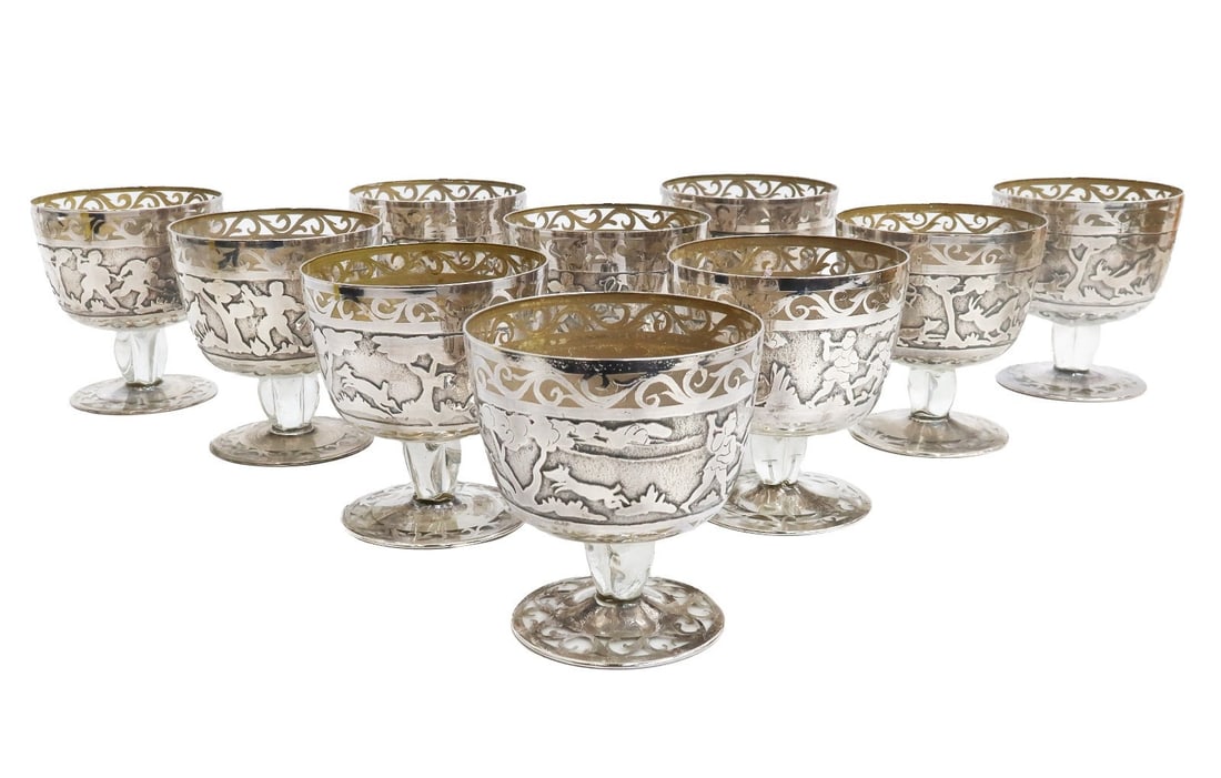 10 American Blown Glass Acid Etched Silver Overlay 10oz Cocktail Goblets 20th C: 10 American blown glass and acid etched silver overlay 10 ounce cocktail goblets or wide champagne saucers, 1st Half 20th Century. Silver overlay hunting scenes to the circular band. Weight Approx. 3 