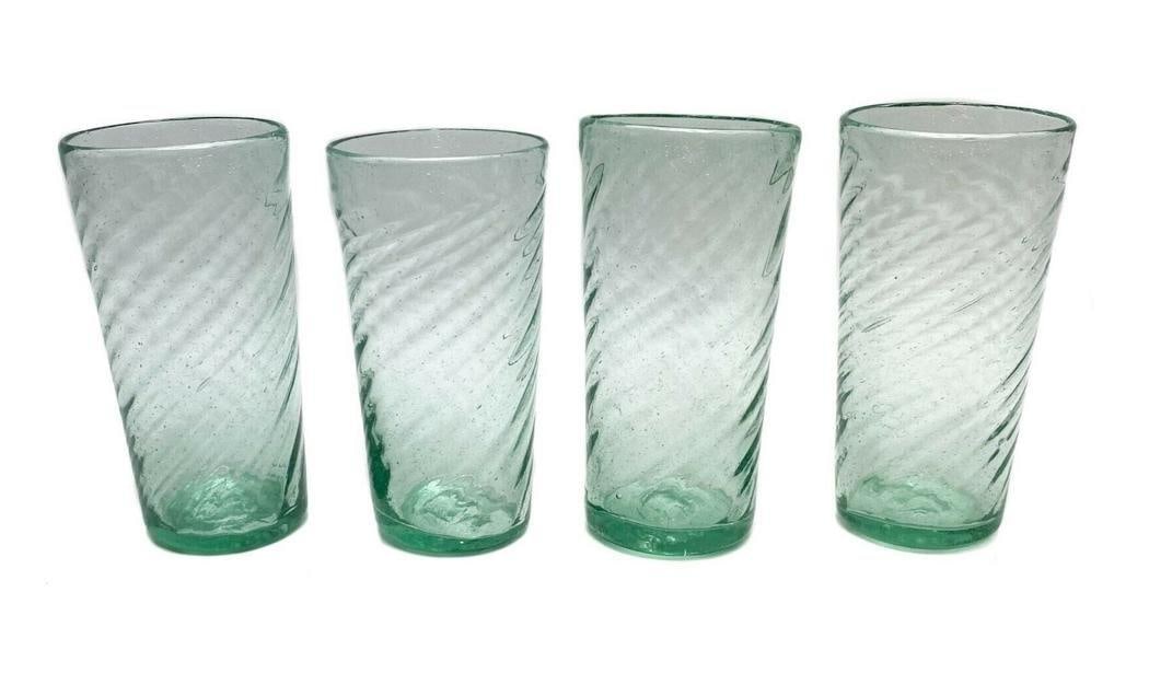 4 Venetian Green Glass Tumblers Controlled Bubbles: 4 green glass tumblers with swirl and controlled bubble decoration throughout. With polished pontil. C second half 20th century. Weight Approx., 2.4 lbs Measures Approx., 3 in. diameter x 5.7 in. tall