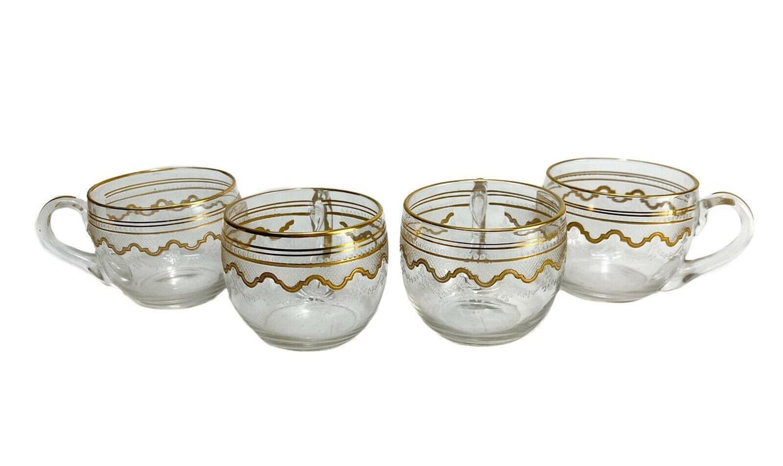 4 Saint (St.) Louis French Glass Punch Cups in Beethoven. Frosted Bands: 4 Saint (St.) Louis French glass punch cups in Beethoven. Gilt and etched frosted band. Weight Approx., 1 lbs Measures Approx., 4 inches x 2.75 inches x 2.25 inches tall Domestic Shipping: $50