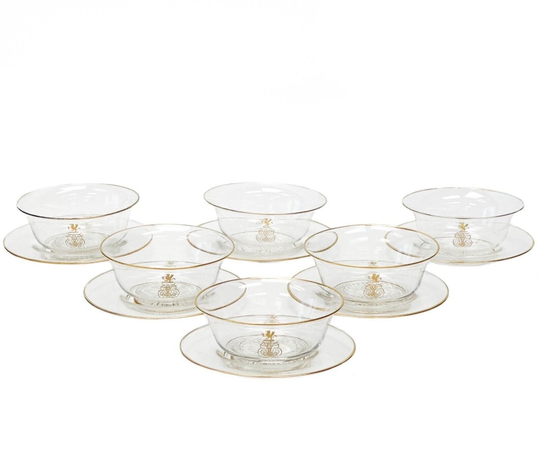 6 Continental Glass Berry / Dessert Bowls with Underplates Gilt Armorial Gryphon: 6 Continental Glass Berry or Dessert Bowls with Underplates, circa 1920. Gilt armorial rampant gryphon to the edge with ornate decorative monogram, gilt to the rims. Star cut feet. Weight: Approx. 5 l