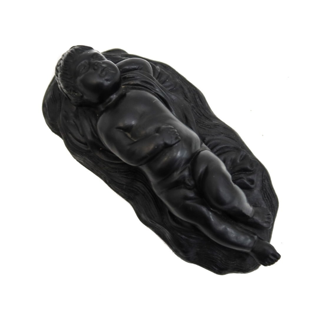 Wedgwood England Black Basalt Sleeping Cherub Figure 18th Century: Wedgwood England black basalt sleeping cherub figure, 18th Century. Marked "Wedgwood" to underside. Weight: Approx. 0.5 lbs Measurements: Approx. 5 inches x 2.5 inches x 1.25 inches tall Domestic Ship
