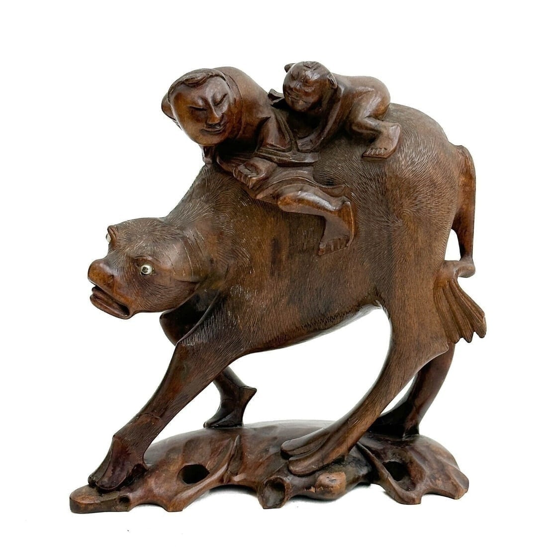 Chinese Hand Carved Figurine Riders on Animal early 20th century: Chinese Hand Carved Figurine, early 20th century. Depicts two riders on a mythical animal, mounted on wood base. Animal with pearl eyes. Weight: Approx. 2 lbs Measurements: Approx. 7.5 inches x 3.25 i