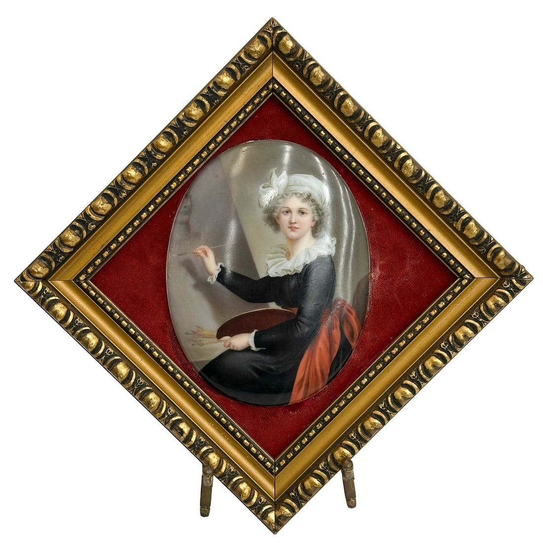 German Hand Painted Porcelain Oval Plaque Mademoiselle Lebrun Framed: German Hand Painted Porcelain Oval Plaque. Depicts a portrait of Mademoiselle Le Brun, titled to the back of plaque. Plaque marked Made in Germany. Mounted in a fabric lined frame. Weight: Approx. 1.5