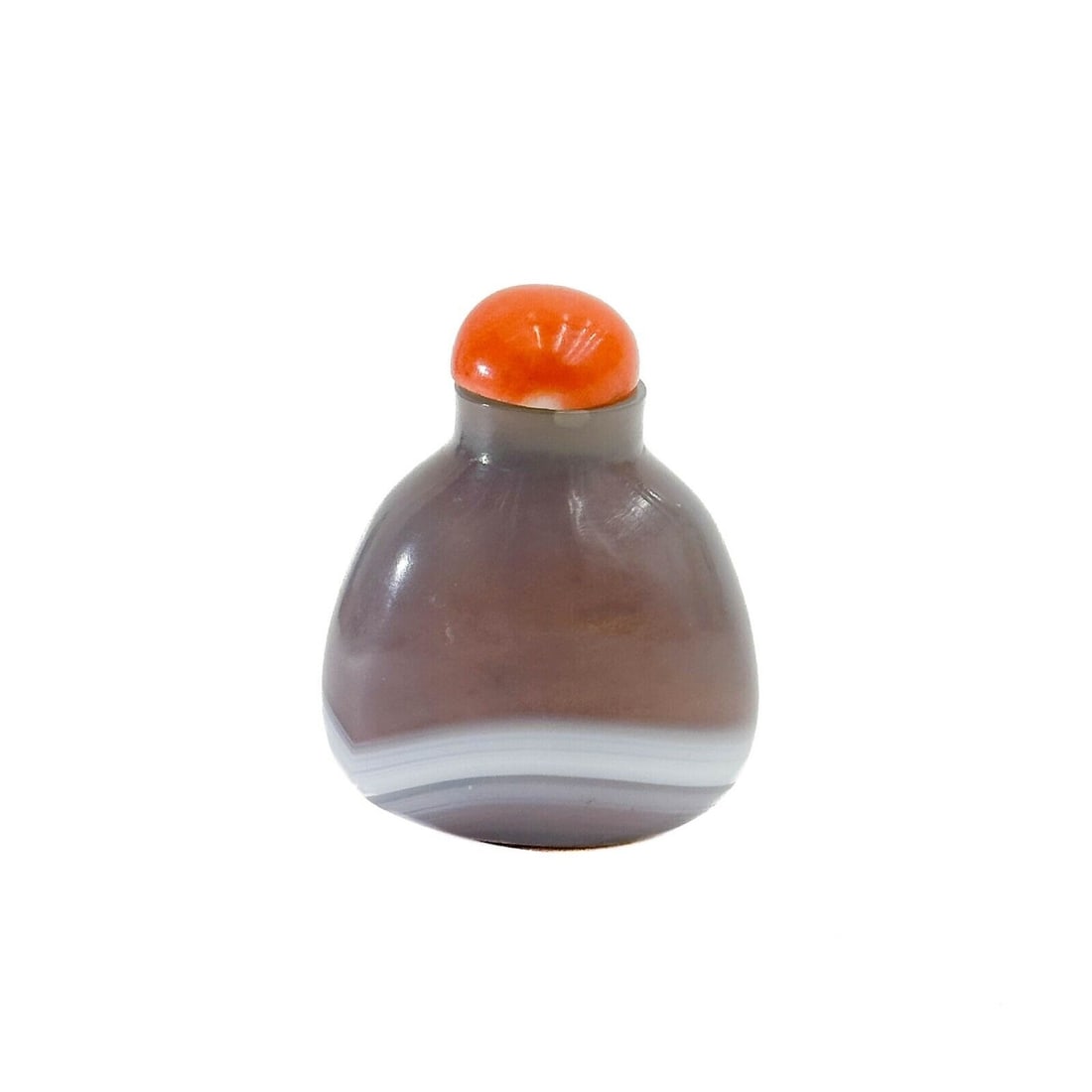 Chinese Carved Banded Agate Snuff Bottle, circa 1850.: Chinese Carved Banded Agate Snuff Bottle, circa 1850. Smokey banded agate body, coral stopper. Weight:approx., less than .5 lb Measurements: Approx., 1.5 inches x .825 inch x 2 inches tall with stoppe