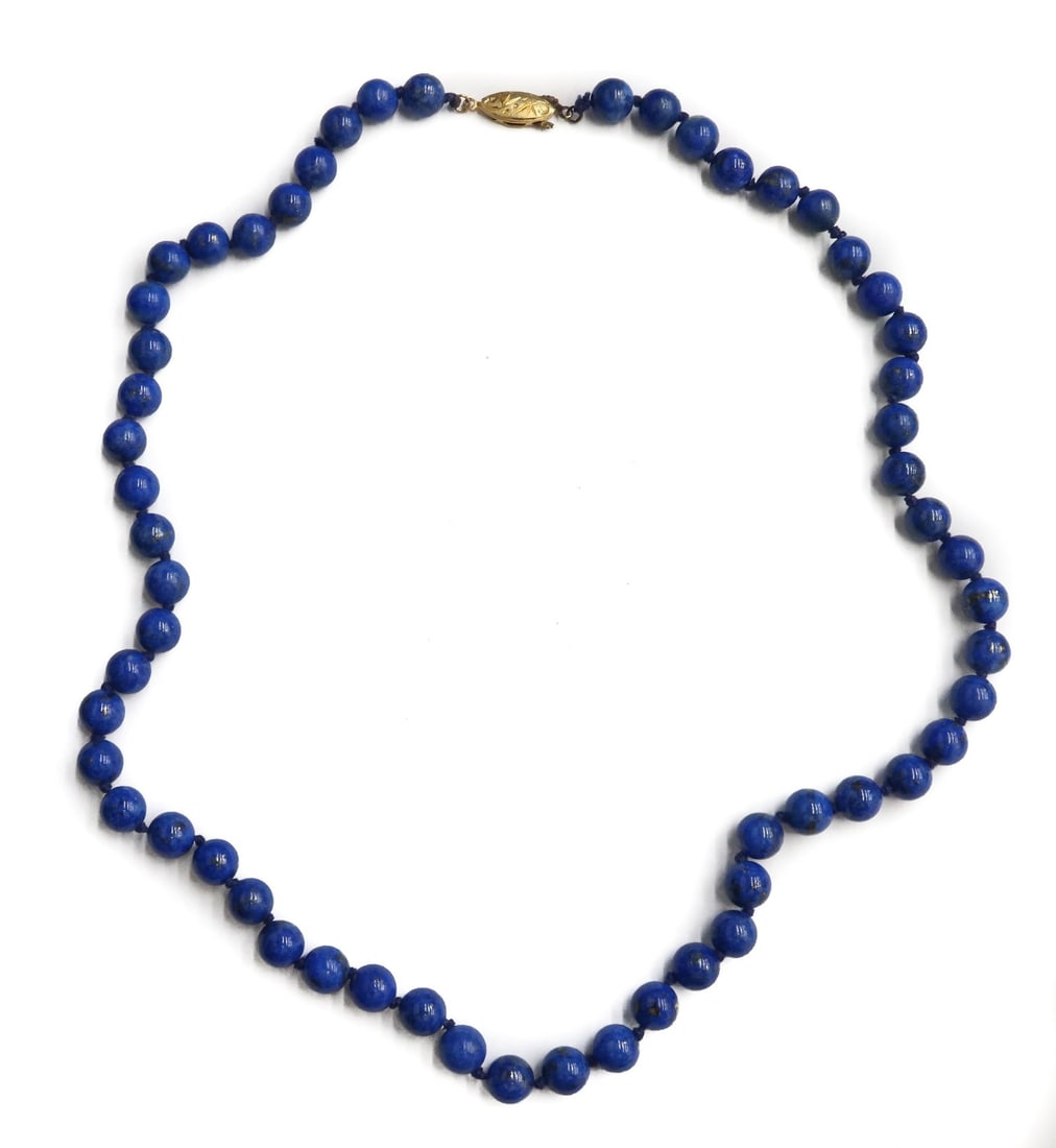 Gilt Silver and Lapis Lazuli Beaded Necklace: Gilt Silver and Lapis Lazuli Beaded Necklace. Lapis Lazuli beads measuring approximately 8.2mm. Marked Silver to the fish eye hook. Weight Approx., 47 grams Measures Approx., 21.5 inches Domestic Ship