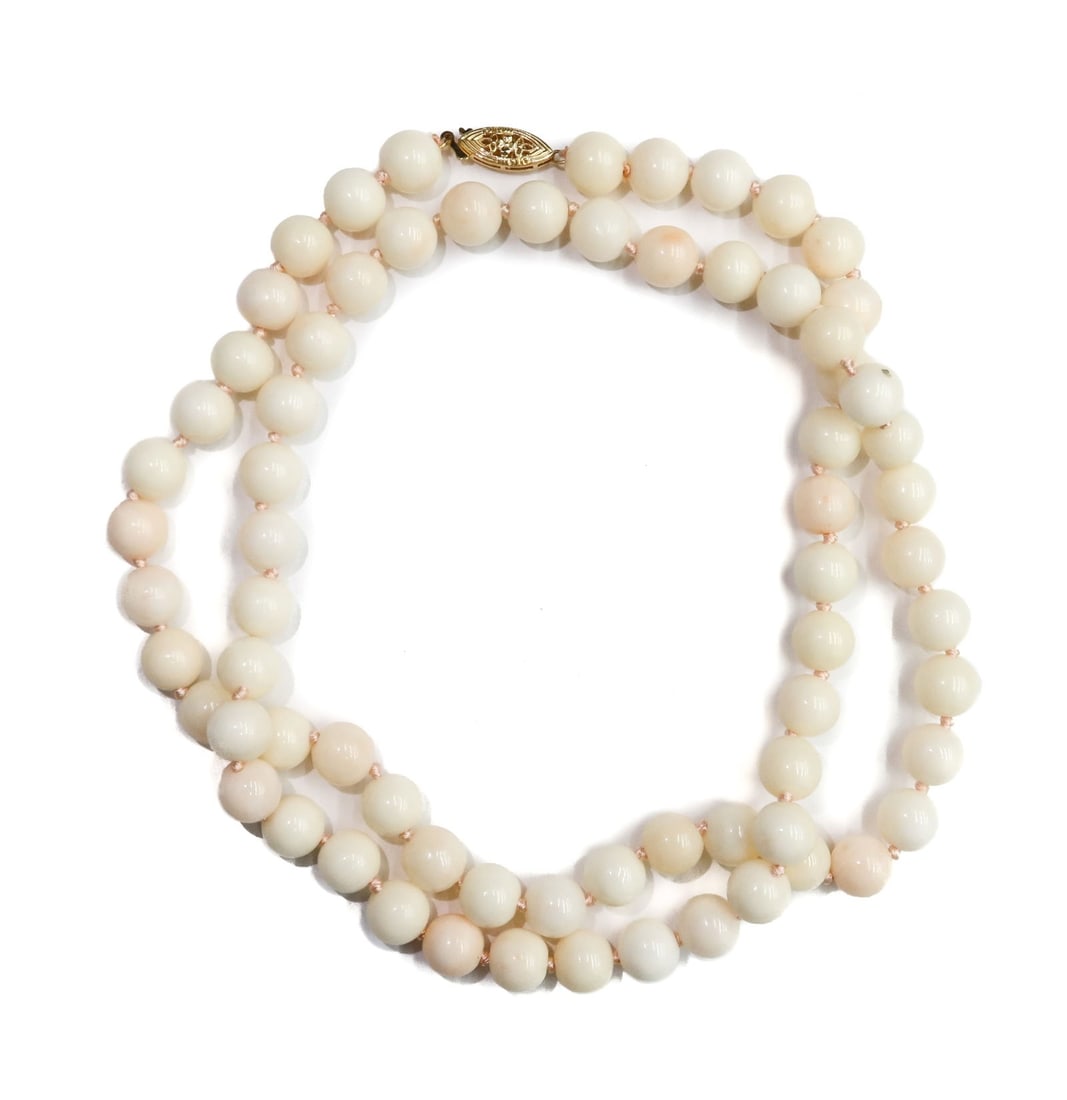 14k Yellow Gold and Angelskin Coral Single Strand Necklace: 14k Yellow Gold and Angelskin Coral Single Strand Necklace. Angelskin coral measuring approximately 8.7mm. Marked 14k to fisheye clasp. Weight Approx., 60.80 grams Measures Approx., 26.25 inches lengt