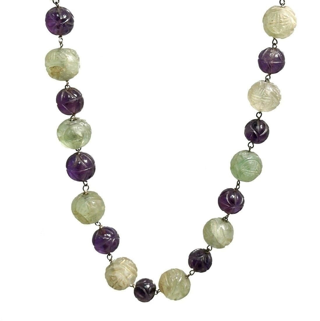 14k yellow gold green and purple graduaded jade beaded necklace.: Chinese 14k yellow gold green and purple graduated jade carved beaded necklace. Interchanging green and purple jade beads measuring from 8mm to 14.6mm . Marked 14k to clasp. Weight Approx., 120 grams 