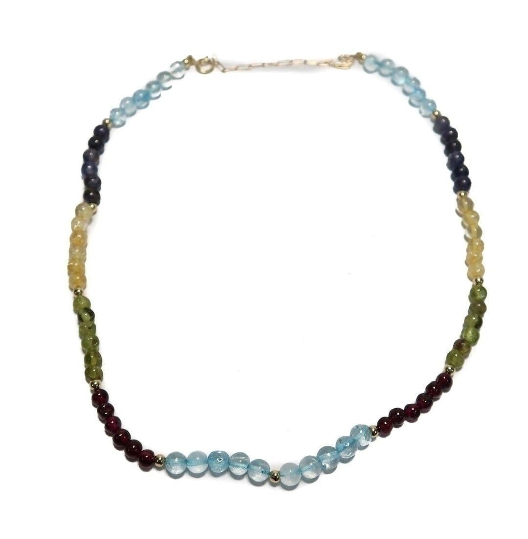 14k Yellow Gold Multi Gem Single Strand Necklace: 14k Yellow Gold Multi Gem Single Strand Necklace. Multi gems including citrine, garnet, iolite, peridot, and quartz measuring approximately 4mm. Marked "585" (14k) to clasp. Weight Approx., 12.20 gram