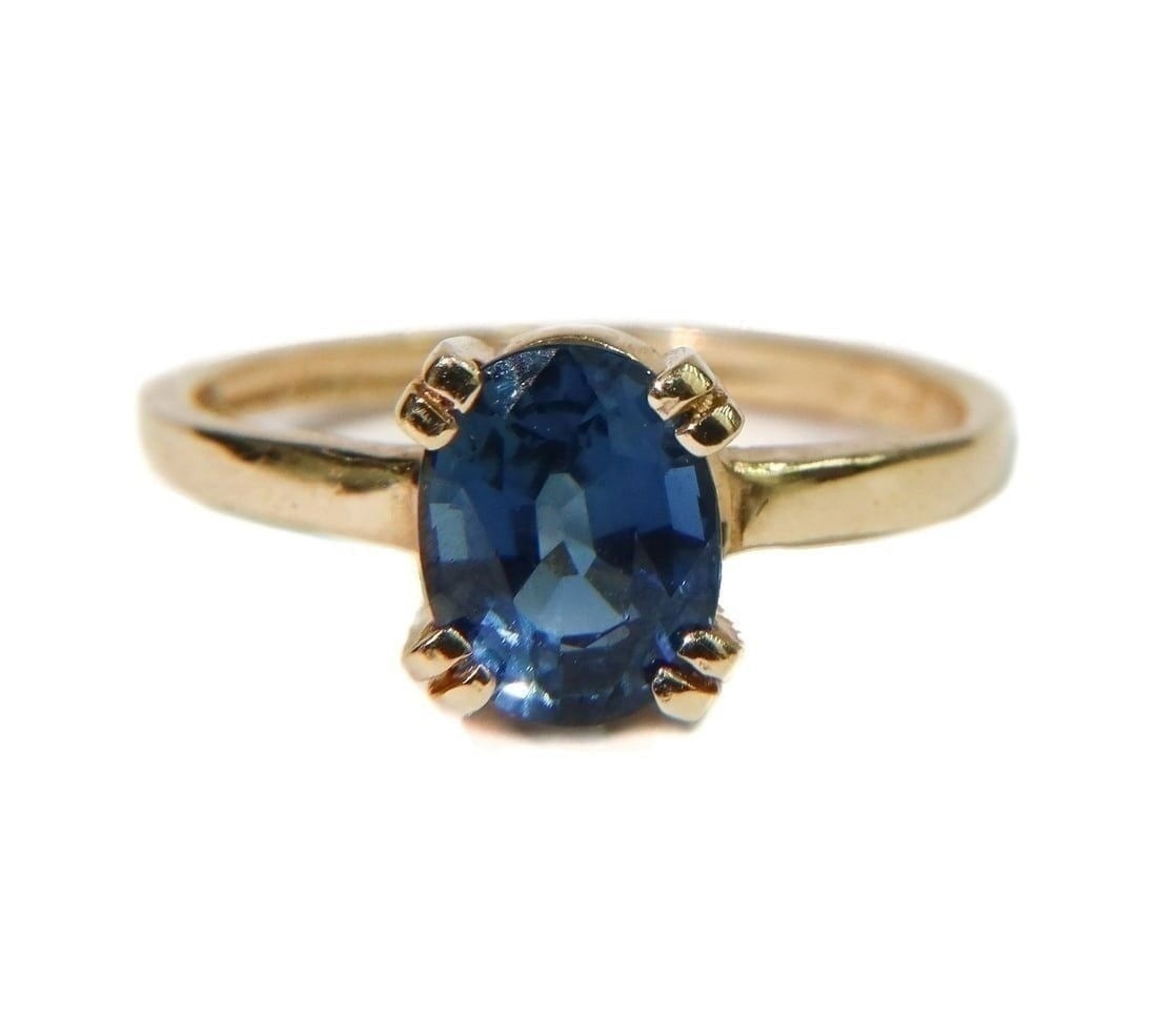 14k Yellow Gold and Blue Sapphire Ring, Size 7.: 14k Yellow Gold and Blue Sapphire Ring, Size 7. Oval cut blue sapphire to center weighing approximately 1.54 carats. Marked "14k" to inner band with maker mark "T" Weight Approx., 2.58 grams Measurs A