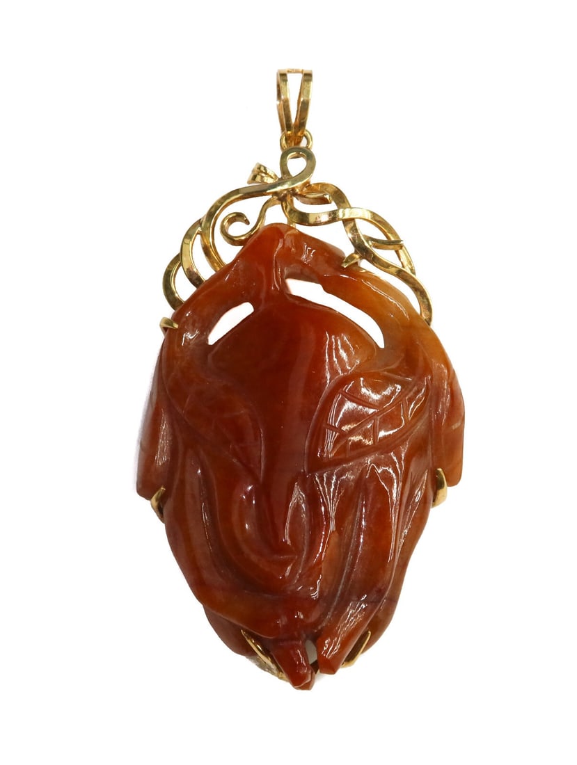 14k Yellow Gold Orange Brown Grey and Green Carved Jade Necklace Pendant GIA: 14k yellow gold carved jade necklace pendant. Craved jade with orange-brown, grey and green hues throughout. Marked 14k 585 to gold frame. With original GIA certificate from 1979 Weight: Approx. 65.93