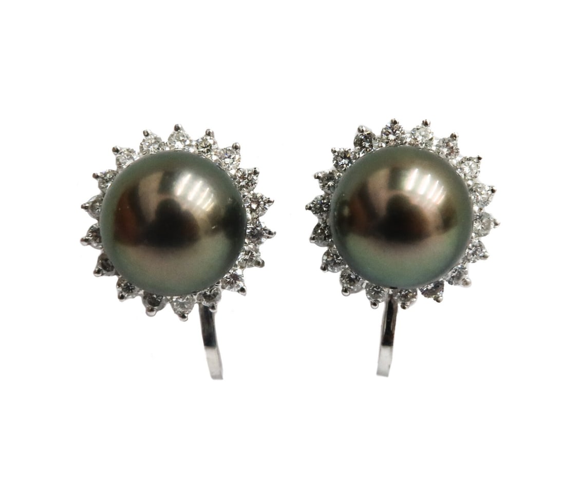 14k White Gold South Sea Cultured Pearl and Diamond Twist Back Earrings: 14k white gold south sea cultured pearl and diamond twist back earrings. South Sea cultured pearls measuring approximately 9.5mm with 18 round cut diamonds to each earring weighing approximately 0.75 