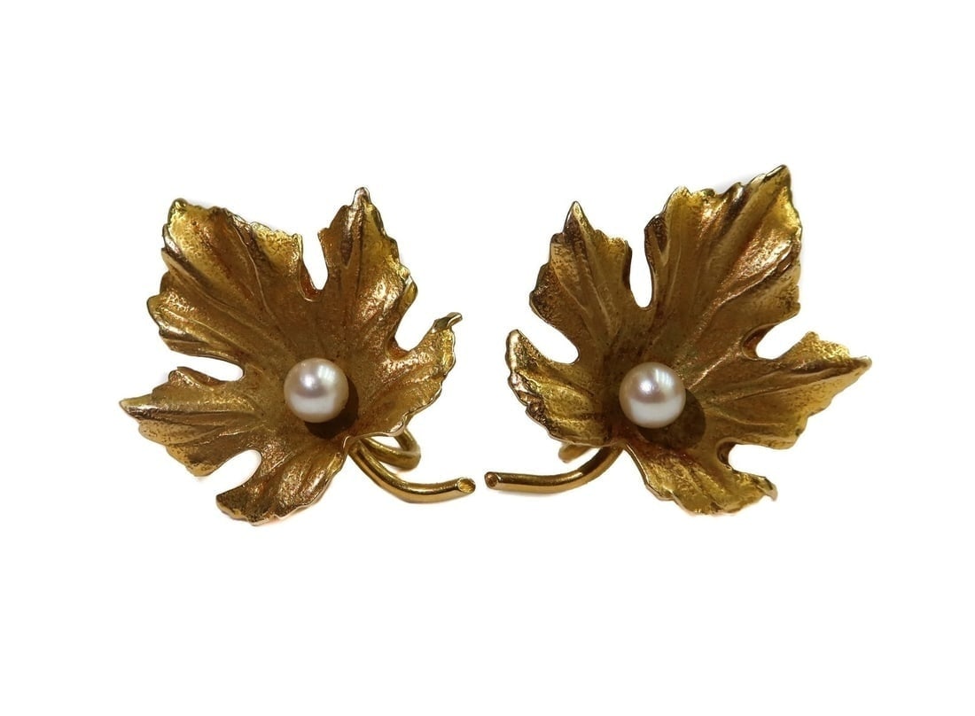 Tiffany & Co. 14k Yellow Gold and Cultured Pearl Maple Leaf Twist Back Earrings.: Tiffany & Co. 14k Yellow Gold and Cultured Pearl Maple Leaf Twist Back Earrings. Etched maple leaves with one applied cultured pearl to center of each earring measuring approximately 3.6mm. Tiffany & 