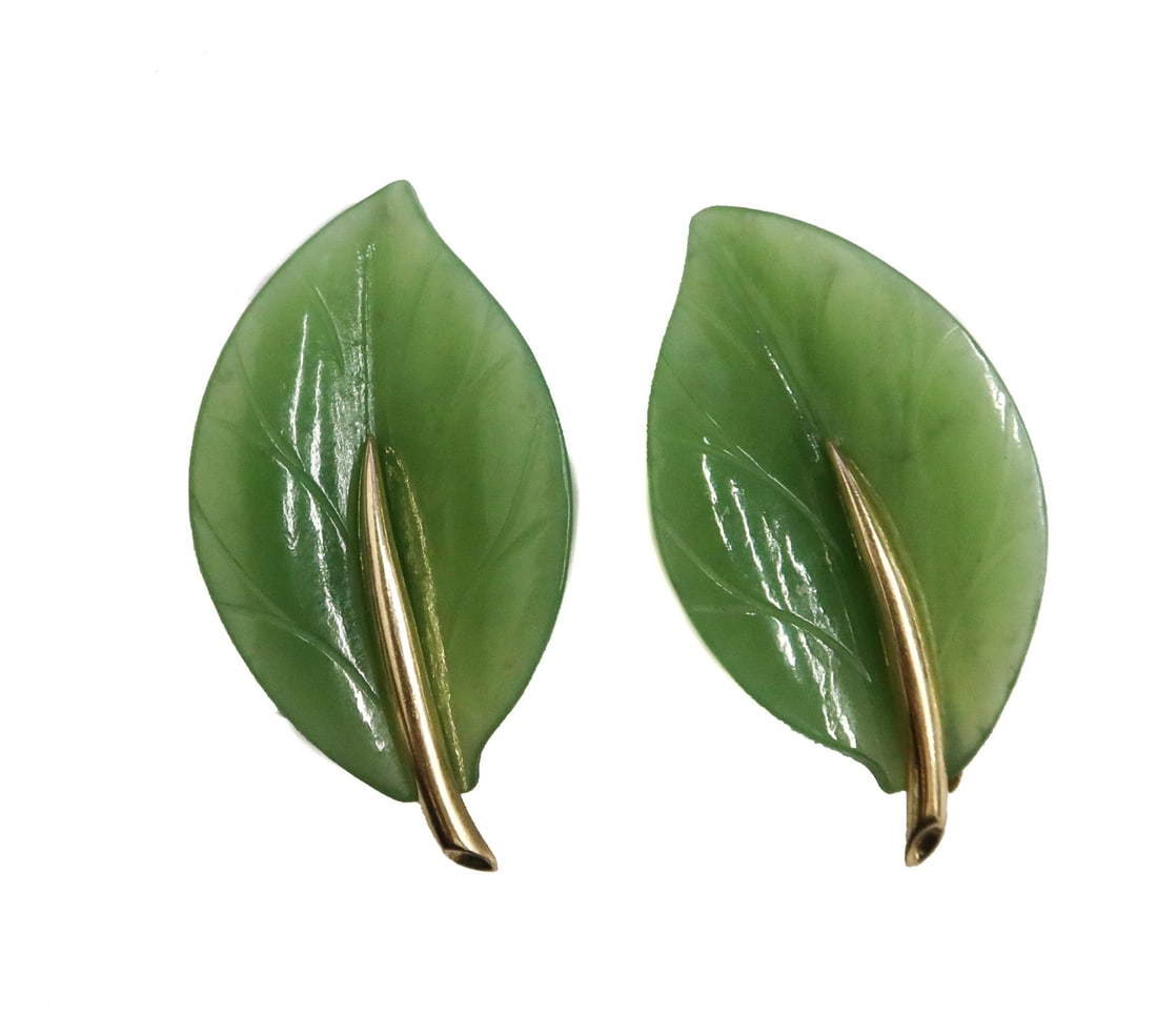 Gump's 14k Yellow Gold and Jade Leaf Twist Back Clip Earrings: Gump's 14k Yellow Gold and Jade Leaf Twist Back Clip Earrings. Marked Gump's 14k. Weight Approx., 4g lbs Measures Approx., 1.25 inches Domestic Shipping:$25