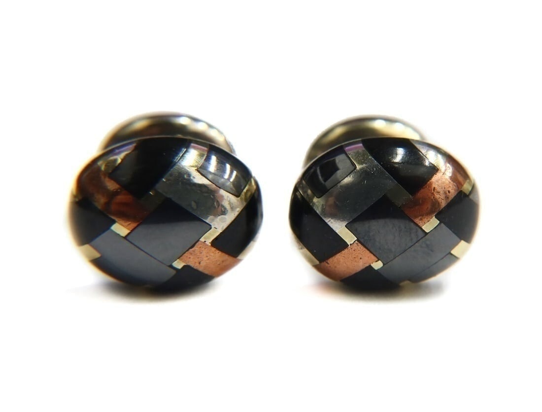 Tiffany & Co 18k Angela Cummings Mixed Metal Yellow Gold Copper Silver Cufflinks: Tiffany & Co. 18k Angela Cummings tri-color mixed metal yellow gold, copper, and silver black jade hematite inlay cufflinks. Marked Tiffany & Co and 750. With original Tiffany & Co box. Weight Approx.