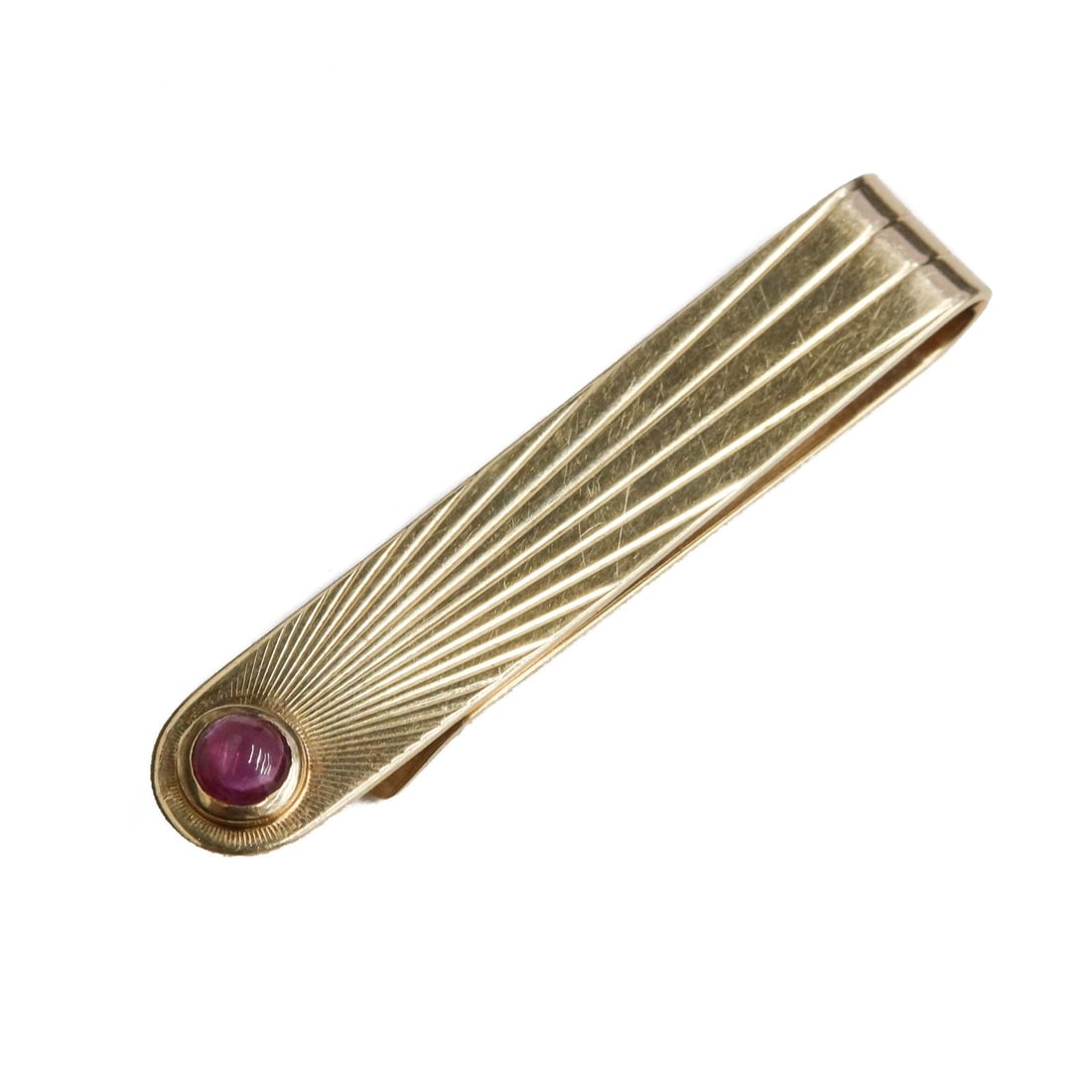 Tiffany & Co. 14k Yellow Gold and Cabochon Ruby Tie Clip: Tiffany & Co. 14k yellow gold and cabochon ruby tie clip. Tiffany & Co. mark to edge. Weight:approx. 8.51 grams Measurements: Approx. 2 inches length x 0.25 inch Condition: Very good condition. Light 