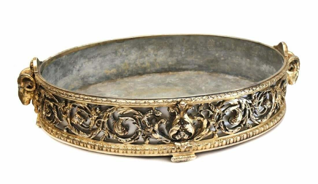 Christofle Gilt Silver Plate Centerpiece Planter or Jardinere, 19th C: A large and impressive gilt silvered bronze planter or jardiniere by Christofle, with open work depicting fruiting vines, the handles realistically modeled as rams heads. With metal liner. Full marks 