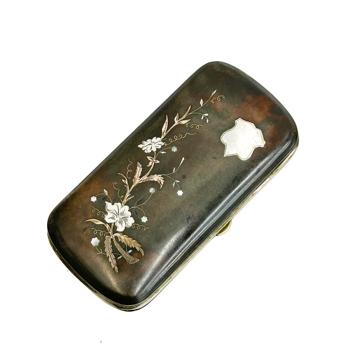 Shell Oval Mixed Metal Silver an Mother of Pearl Oval Case late 19th century: Shell Oval Mixed Metal Silver and mother of pearl case, late 19th century. Oval shaped case, silver, mother of pearl, gold, and gilt silver inlaid decoration. Red fabric interior. Approximate weight: 