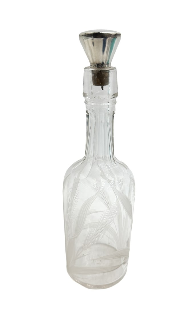 American Sterling Silver and Cut Glass Wheat Decanter: American Sterling Silver and Cut Glass Wheat Decanter. Etched wheat throughout the exterior. Marked Sterling to the stopper. Weight: Approx. 1 lbs Measurements: Approx. 3.5 inches diameter x 11