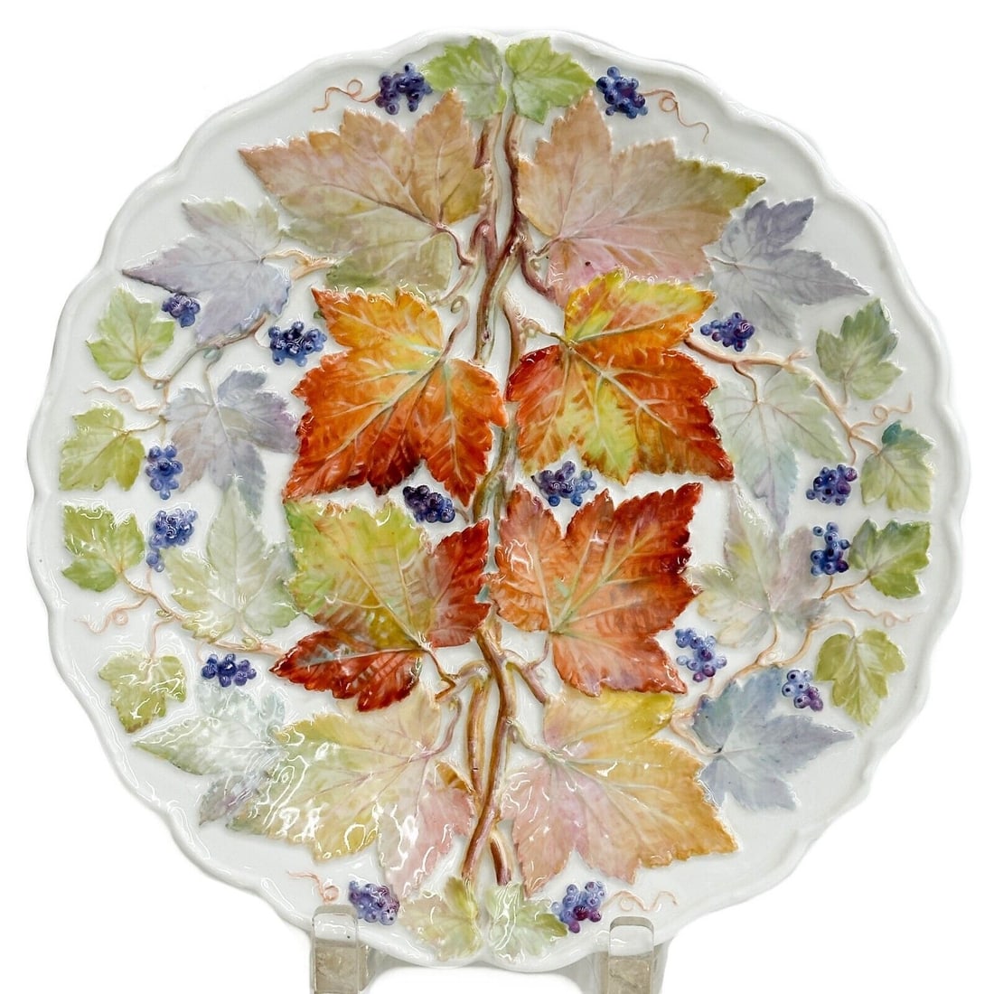 Meissen Germany Hand Painted Porcelain Glazed Leaf Berry Plate circa 1800: Meissen Germany Hand Painted Porcelain Leaf Plate, circa 1800. Colorful raised leaf and berry decoration, scalloped edge. Underside with Meissen crossed swords mark, subtle slashes through the Meissen