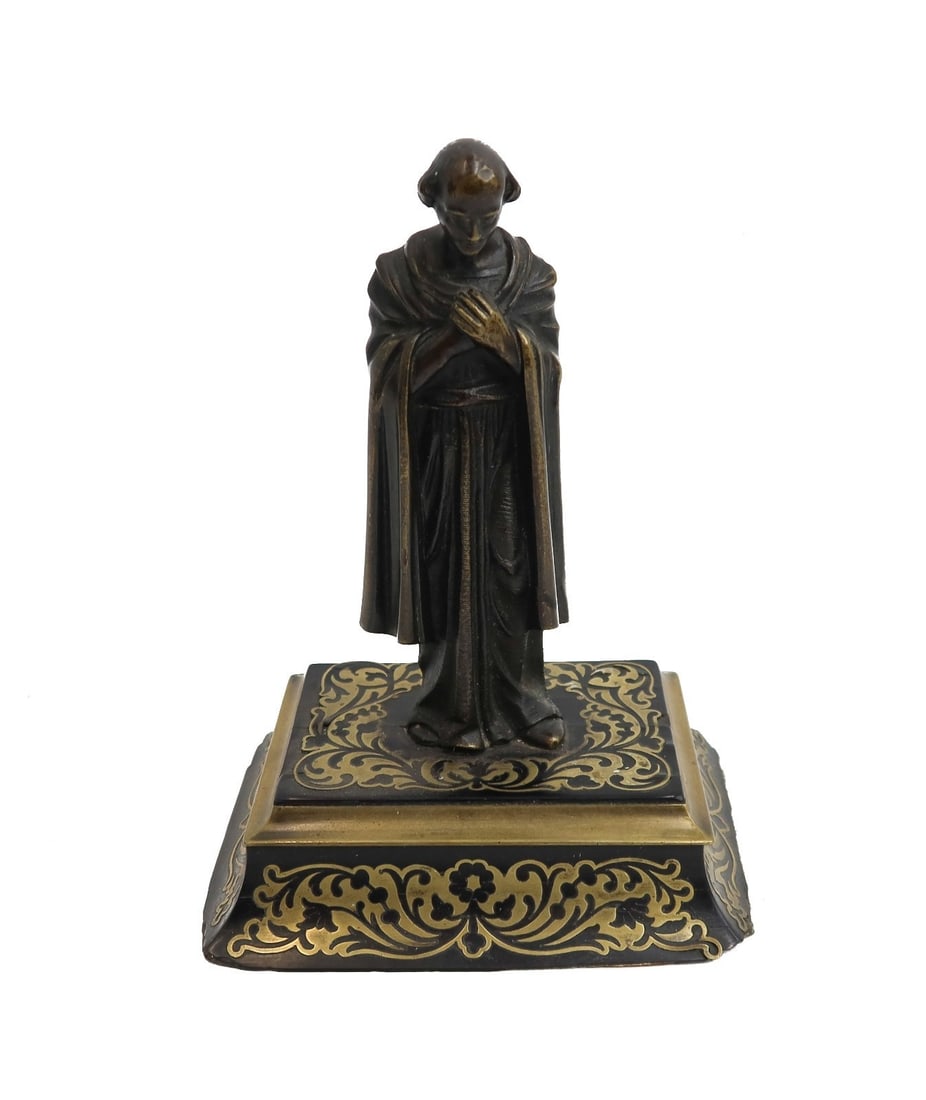 Continental Figural Gilt Bronze and Wood Base Figure of a Saint: Continental figural gilt bronze and wood base figure of a Saint. The figure depicts a robed Saint with his hands crossed in front of his chest. Gilt accents to the highlights of the robe and to the la