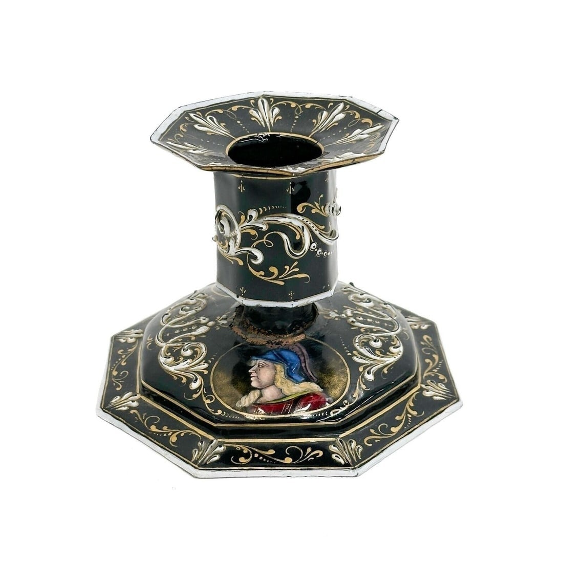 Limoges Enameled Candlestick Holder Black Painted Portraits 19th century: Limoges France Enameled Candlestick Holder, 19th century. A black ground decorated with white and gilt foliate decoration, portraits to the base. Weight: Approx. .5 lb Measurements: approx. 5.5 inches