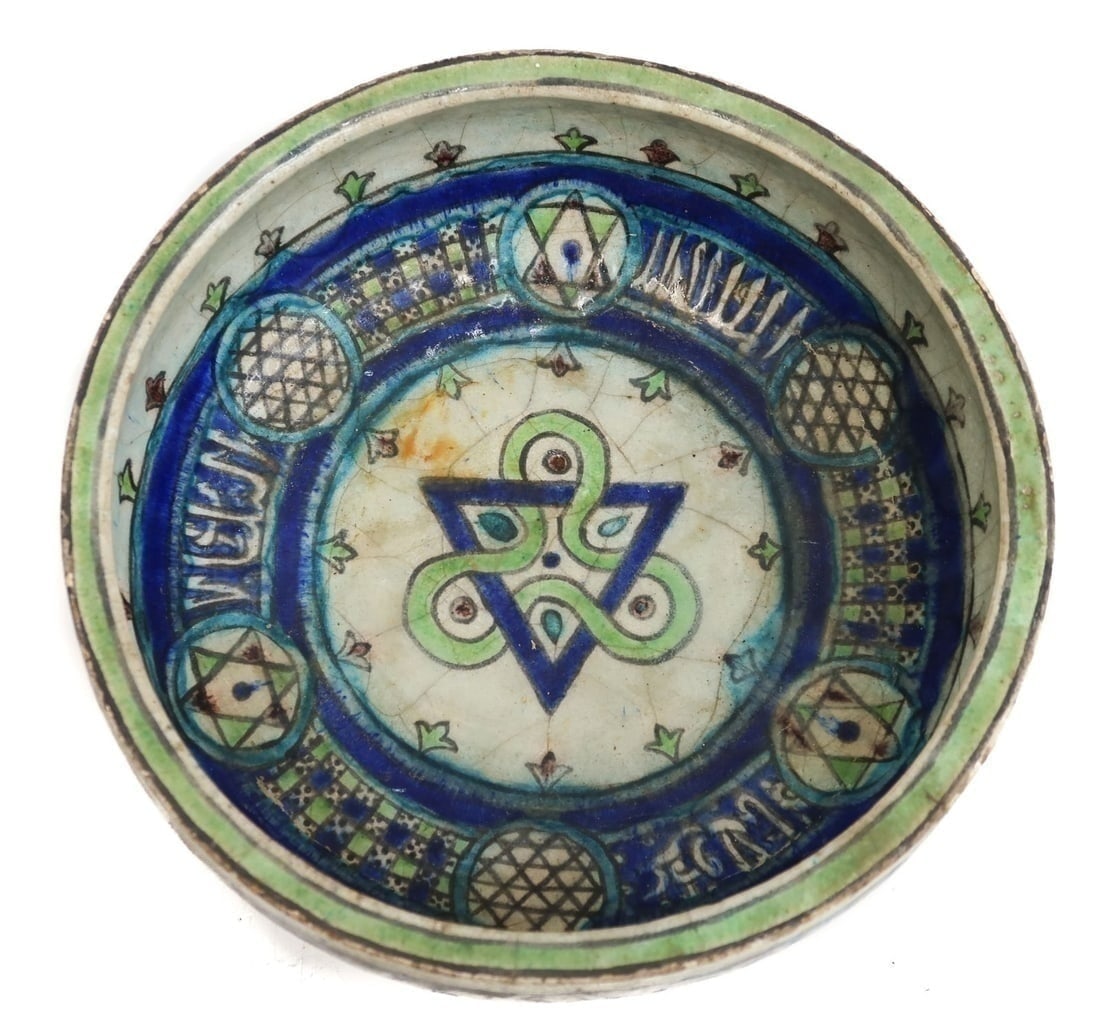 Persian Kashan Glazed Pottery Bowl: A Kashan transparent glazed pottery bowl, geometric designs in blue and green with subtle purple. 13th Century , Iran. Weight Approx., 5 lbs Measures Approx., 10 inches diameter x 5.25 inches tall Dom