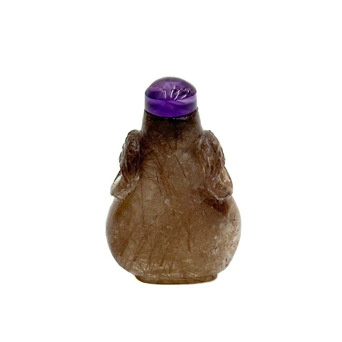 Chinese Carved Hair Crystal Snuff Bottle Amethyst Stopper early 19th century: Chinese Carved Hair Crystal Snuff Bottle, early 19th century. Flat pear shaped hair crystal bottle with rutile needles within the stone. Carved lion mask handles to the sides. Amethyst stopper Weight: