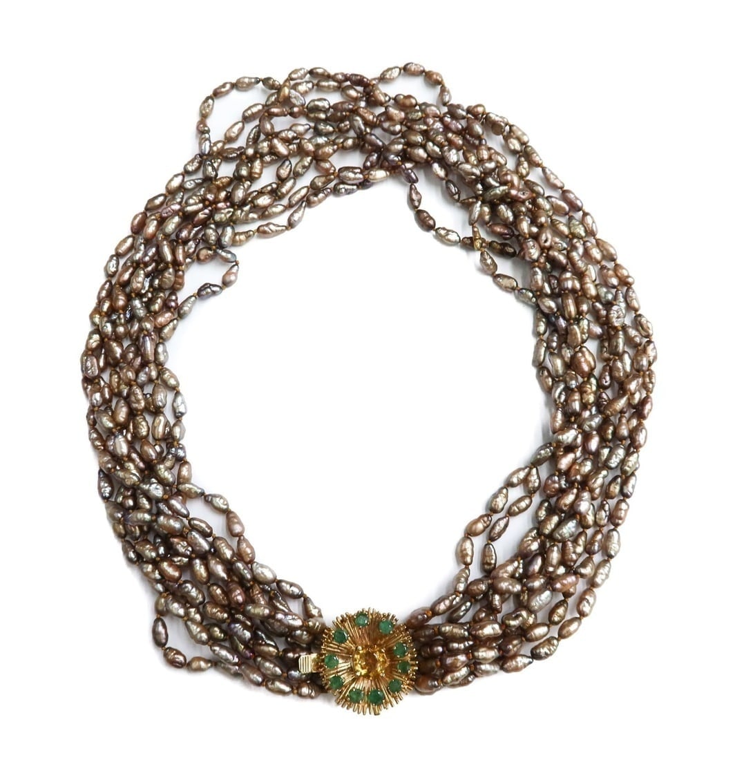 14k Yellow Gold Emerald and Citrine Baroque Pearls Emerald and Citrine 10 Strand Necklace: 14k Yellow Gold Emerald and Citrine Baroque 10 strand pearl necklace. Brown/purple iridescent pearls measuring arOund 7.1mm x 3.5mm. Sunburst gold clasp with 10 round cut emeralds and a larger citrine