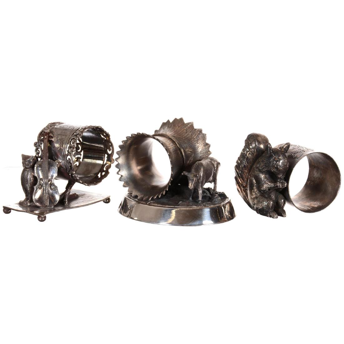 Three Figural Silverplate Napkin Rings Including (1 of 4)