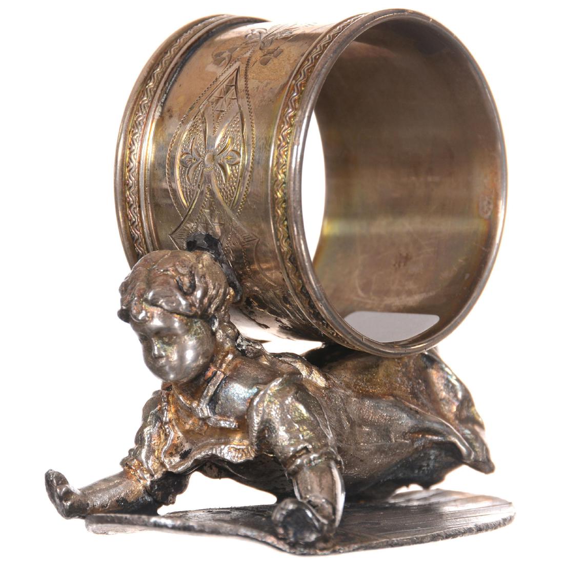 Figural Silver-plate Napkin Ring: 2.75" Figural Silver-plate Napkin Ring Wilcox #01548 - Young Girl Lying on American Shield with Napkin Ring on Back