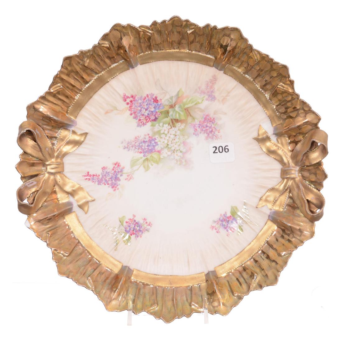 Unmarked R.S. Prussia Bowtie Mold Cake Plate: Unmarked R.S. Prussia Bowtie Mold Cake Plate - 10.5" - Cream Satin Finish Center with Floral Decor - Ornate Gold Border - Does Have A Small Surface Flake on Edge of Plate