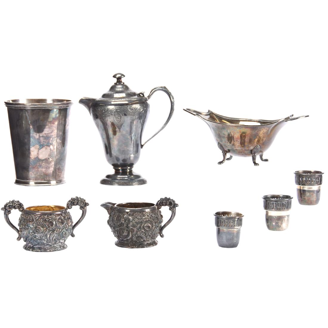 Assorted Silverplate Items: Assorted Silverplate Items Including - (1) 6" Pedestal Creamer - (1) 4.5" Tumbler, International Silver - Heavily Embossed Creamer and Sugar Set - (1) Oval Footed Dish - (3) Matching Thimble Shaped Cu
