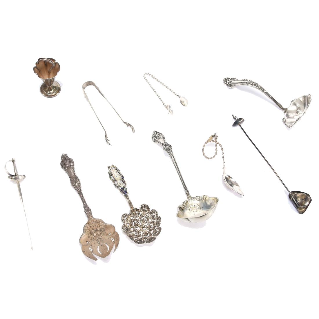 (11) Assorted Sterling Silver Items: (11) Assorted Sterling Silver Items Including - (1) Umbrella Shaped Toothpick Holder - (2) Tongs - (4) Ladles - (1) "Sword" Pick - (1) Sword and Hat Candle Snuffer - and More - See Photos for Details