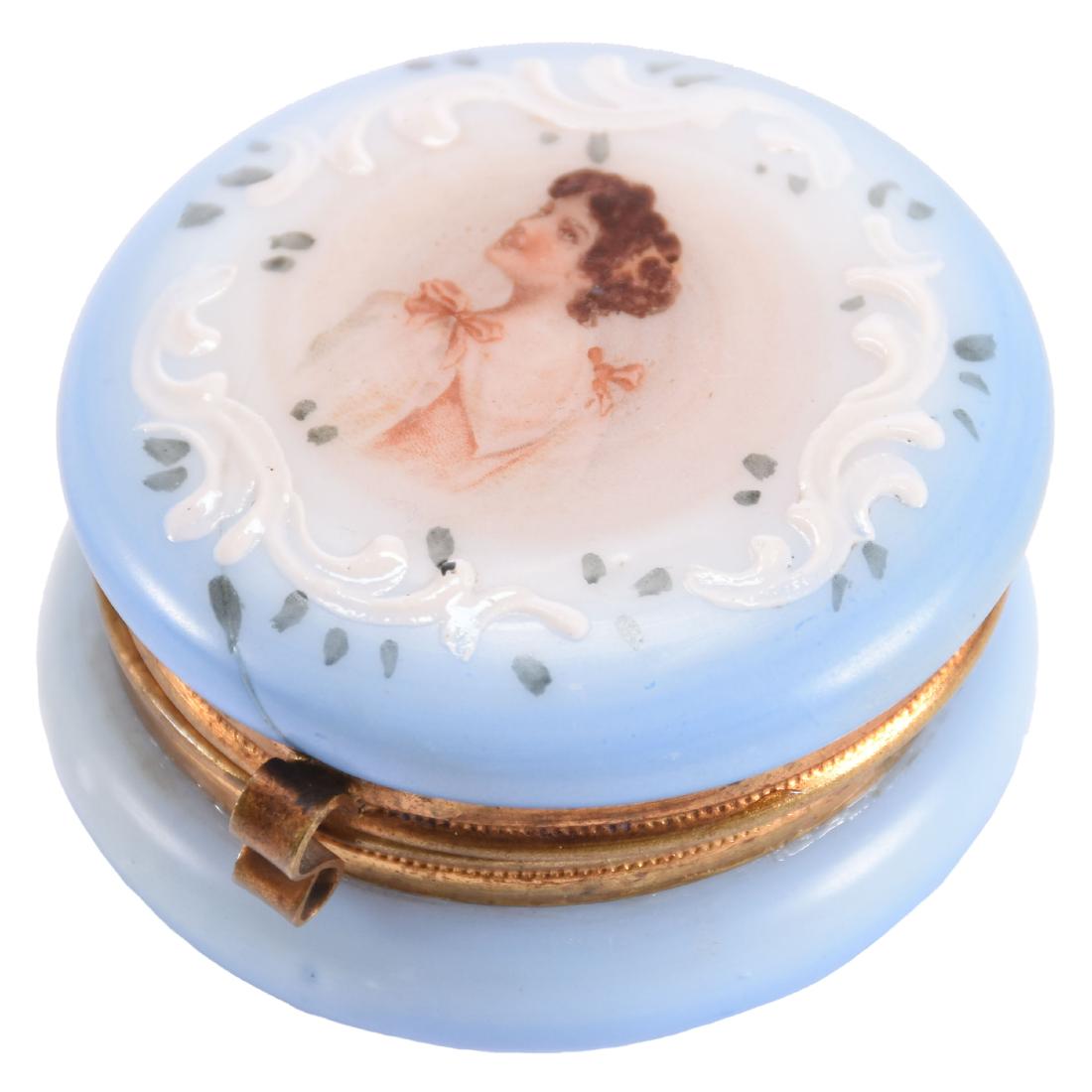 Hinged Art Glass Pill Box 1.5" X 2.25": Hinged Art Glass Pill Box - 1.5" X 2.25" - Opaque with Blue Background and Portrait of Young Woman