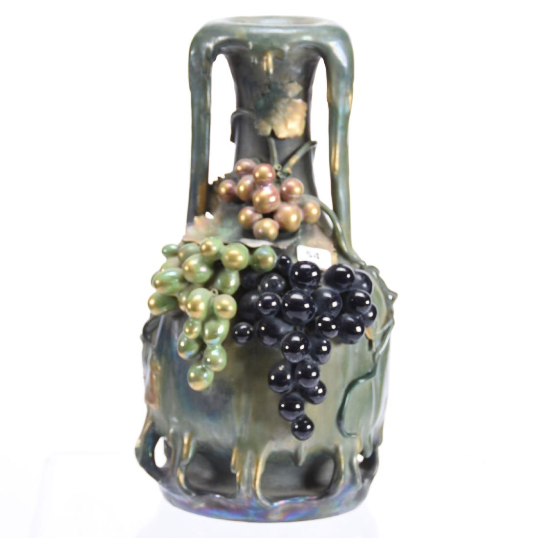 Amphora Marked Two Handled Vase 12.5" X 7": Amphora Marked Two-Handled Vase - 12.5" X 7" - Mildew Green Iridescent Background with Grape Vine and Grapes Decor - Unusual Triangle Mark "Edda" #3617 58 with Swastika - Rim Appearing to Drip Candle