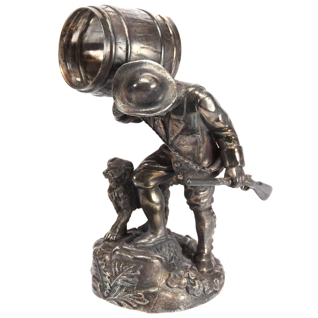 Figural "Rip Van Winkle" Napkin Ring 5.25": Figural Silverplate Napkin Ring - 5.25" - AKA Rip Van Winkle by Simpson Hall & Miller #80 - Man Carrying Rifle and Barrel Walking with Dog - Rifle Barrel Possibly Repaired & Currently Loose - “Rip V