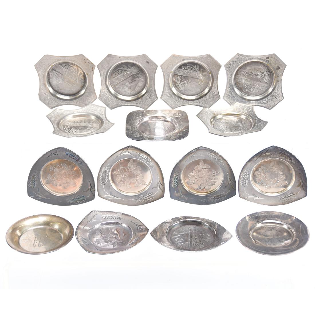 Collection of (15) Silverplate Butter Pats: Collection of (15) Silverplate Butter Pats intended for Condiment Sets - (6) Matching Square with Swan Decor - (4) Matching Triangular - (4) Not Matching - (1) Sterling
