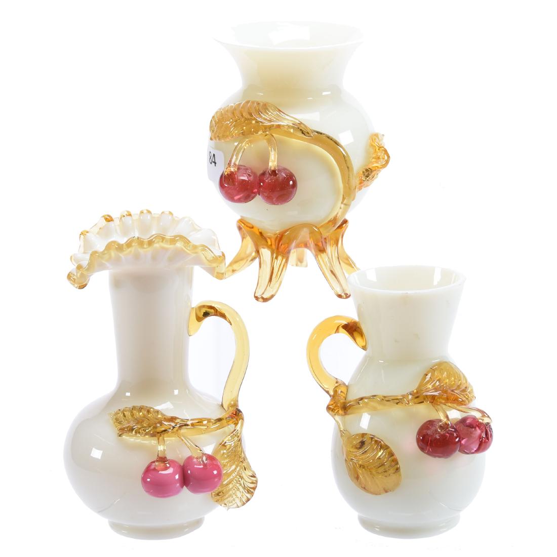 (3) Stevens & Williams Art Glass Vases: (3) Stevens & Williams Art Glass Vases - All Are Cased White with Applied Amber Branch and Red Cherry Decor - (1) 6" Handled Ewer - (1) 5" Footed Vase - (1) 4.75" Handled Pitcher, Small Rim Nick