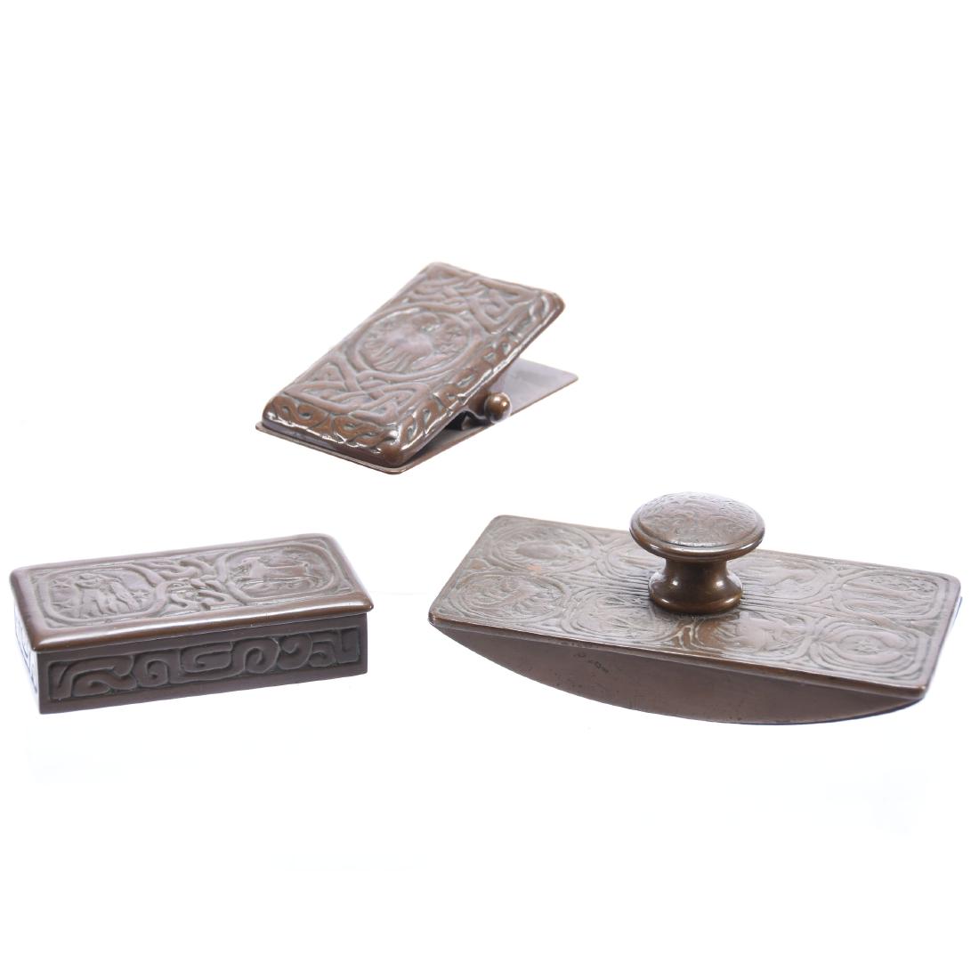 (3) Signed Tiffany Studios Zodiac Desk Items: (3) Signed Tiffany Studios Zodiac Desk Items - (1) 2" X 5.5" #990 Ink Blotter Roller - (1) 3.75" Paper Desk Clip #1080 - (1) 1" X 3.75 X 2" #802 Stamp Box