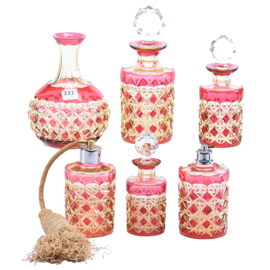 (6) Cranberry Cut to Vaseline Vanity Items: (6) Cranberry Cut to Vaseline Vanity Items - All in Same Pattern - Diamond and Punte Motif - Attributed to Val St. Lambert - (1) 7.75" Cologne - (1) 6.25" Cologne - (1) 5.5" Perfume - (2) 5" Atomizers