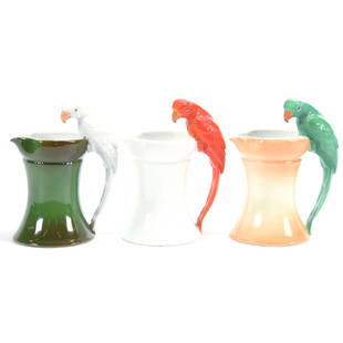 (3) Figural Milk Pitchers Royal Bayreuth Blue Mark: (3) Figural Milk Pitchers - Royal Bayreuth Blue Mark - Parrot Handled - (1) 6.5" Green Parrot Handle, Cream Body (Unmarked); (1) 6.5" White Parrot Handle, Green Body; (1) Red Parrot Handle, White Body