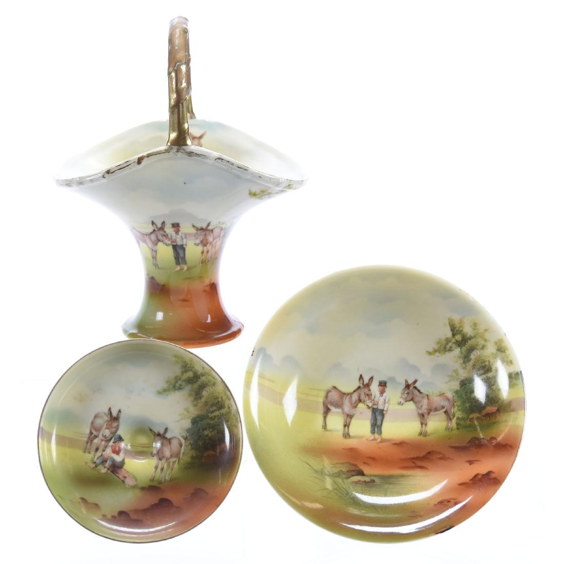 (3) Boy & Donkey Royal Bayreuth Blue Mark Items: (3) Boy & Donkey Royal Bayreuth Blue Mark Items - (1) 7" Basket - (1) 2.75" X 5.75" Compote - (1) 2.75" X 4.25" Compote (Does Not Sit Level)