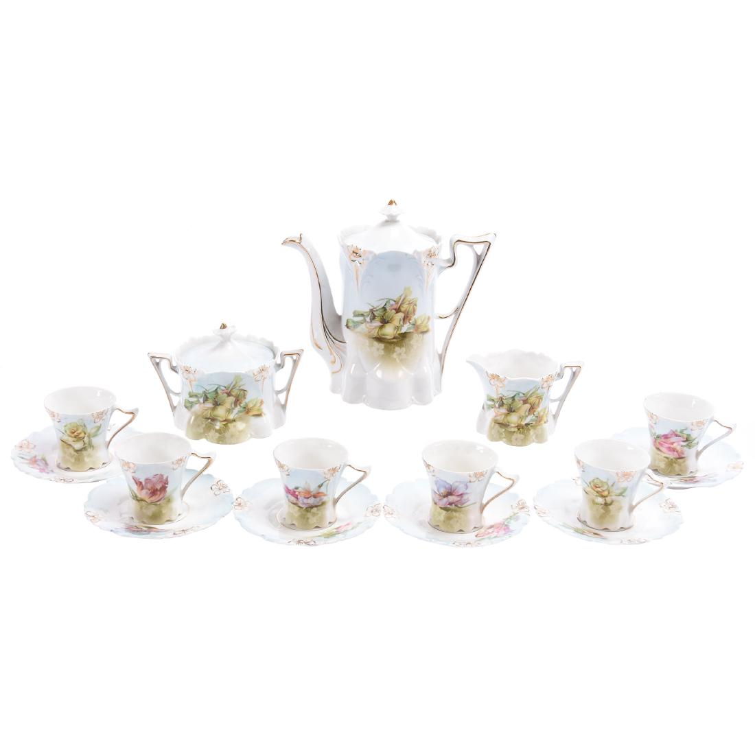(15) Piece Unmarked Child's Tea Set: (15) Piece Unmarked Child's Tea Set - 6" Pot - Lily Mold - Blue and White Tones with Scattered Floral Decor - Selling with Creamer, Sugar with Lid, (6) Cups & Saucers - Lid on Tea Pot Looks Good but I