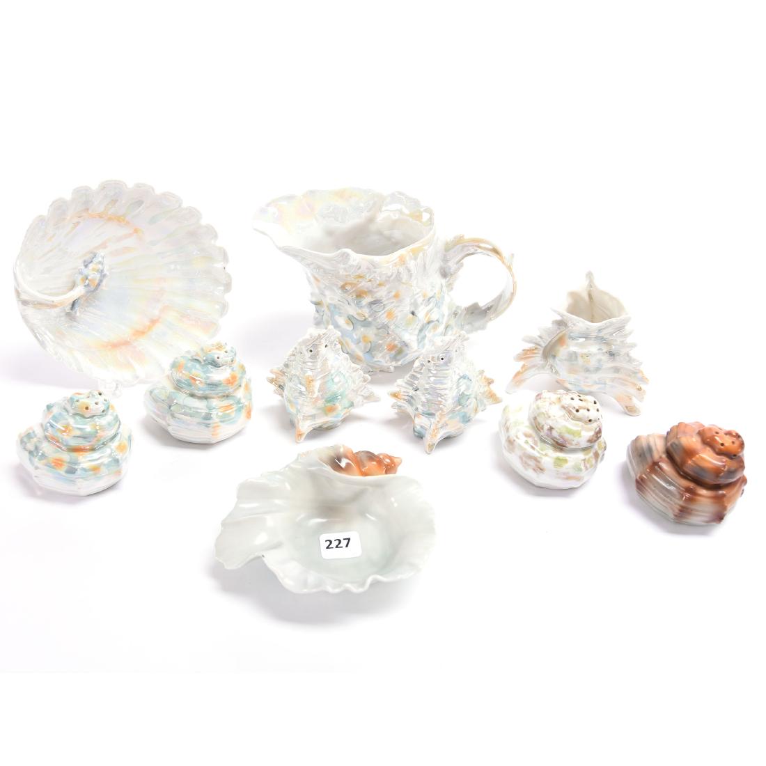 (10) Figural Shell Items Royal Bayreuth: (10) Figural Shell Items - Royal Bayreuth - (1) 4.25" Milk Pitcher - (3) Pairs Salt & Pepper Shakers - (1) 3" Toothpick Holder - (1) 5.25" Nappy - (1) 4.5" Ash Tray