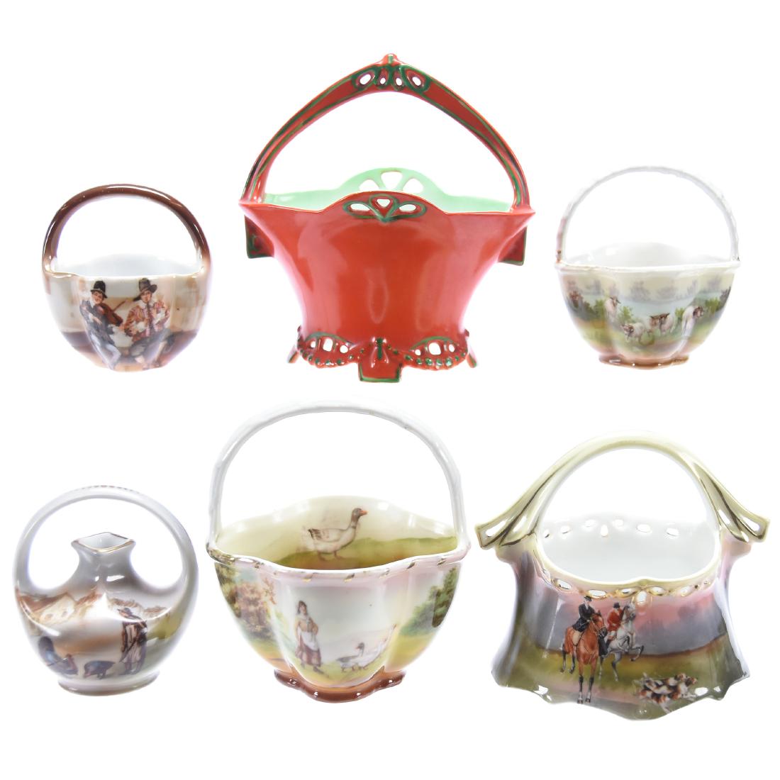 (6) Royal Bayreuth Blue Mark Baskets: (6) Royal Bayreuth Blue Mark Baskets - (1) 5" X 5" Red Open Lattice Basket - (1) 3.5" X 5" Fox Hunt Scenic Decor - (1) 4.5" X 4" Girl and Geese Scenic Decor - (1) 3" X 2.5" Musicians Scenic Decor - (1