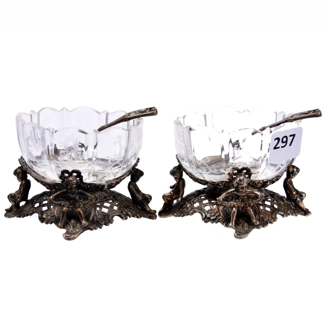 (2) Salt Dips, Engraved Floral Motif: (2) Salt Dips - Brilliant Cut Glass - 2.25" X 3.5" - Oval with Engraved Floral Motif - Set on Figural Marked Germany 800 Silver Stands with Cherub Design