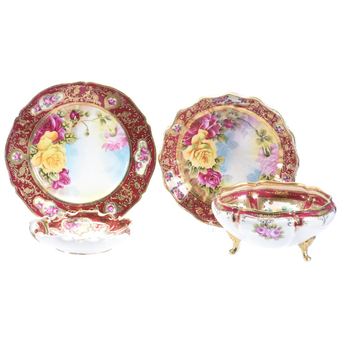 (4) Marked Nippon Items, Red Border & Floral Decor: (4) Marked Nippon Items with Red Border & Floral Decor; (1) 10" Plate; (1) 9.5" Footed Bowl; (1) 8" Footed Bowl; (1) 6.25" Handled Ruffled Nappy
