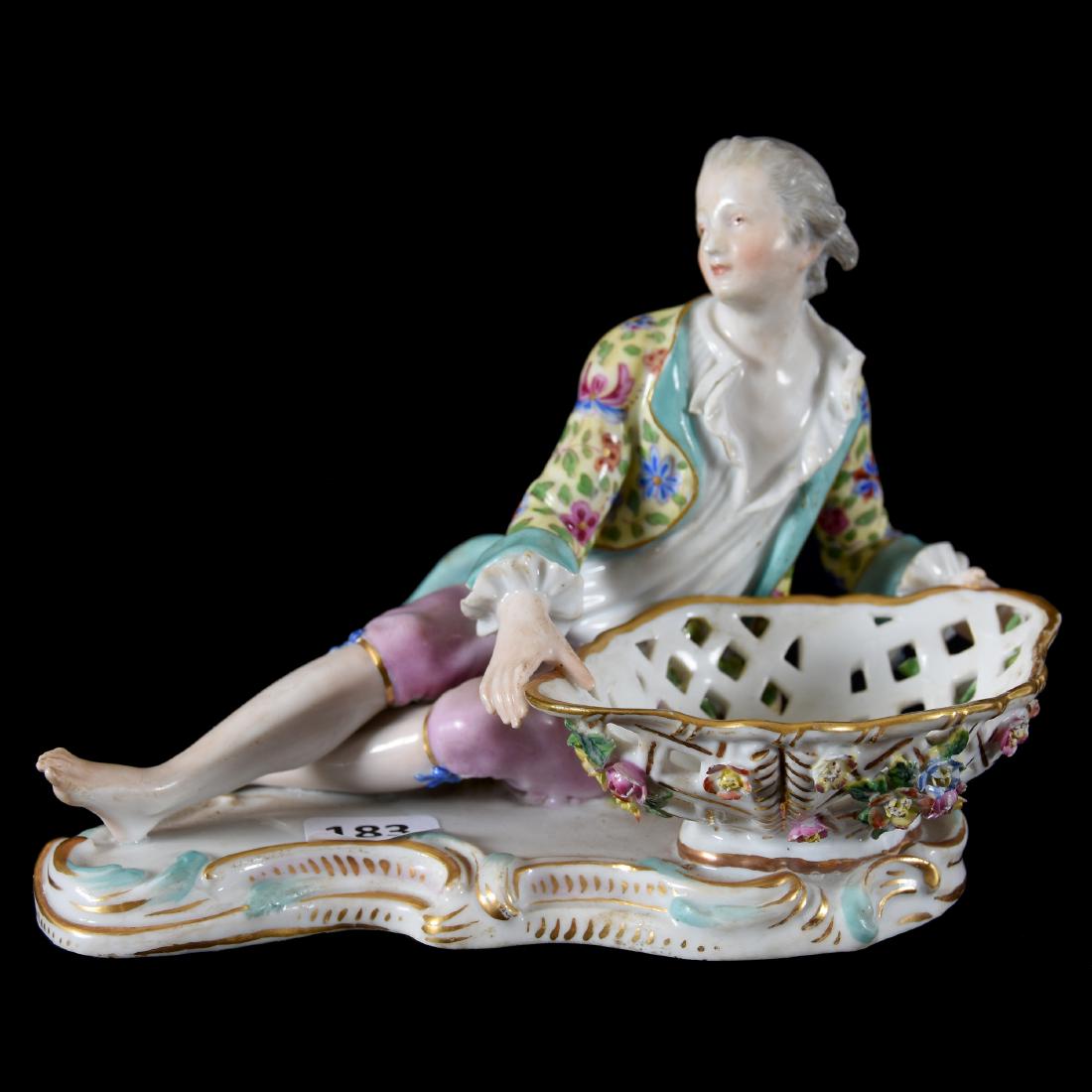 Figural Nut Dish Marked Meissen: Figural Nut Dish Marked Meissen, 5" X 7", Full Figure Man Reclining Near Reticulated Bowl, One Toe with Surface Chip, Meissen Mark Is Faint