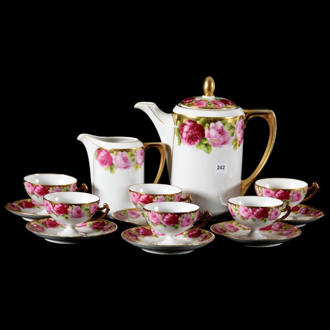 Fourteen Piece Porcelain Coffee Service: Fourteen Piece Porcelain Coffee Service, Set Includes 9.5" Coffee Pot, 5.5" Creamer; (6) Pedestal Cups and; (6) Saucers, All Are White with Gold Border and Pink Rose Decor, Only the Cups Are Marked, B