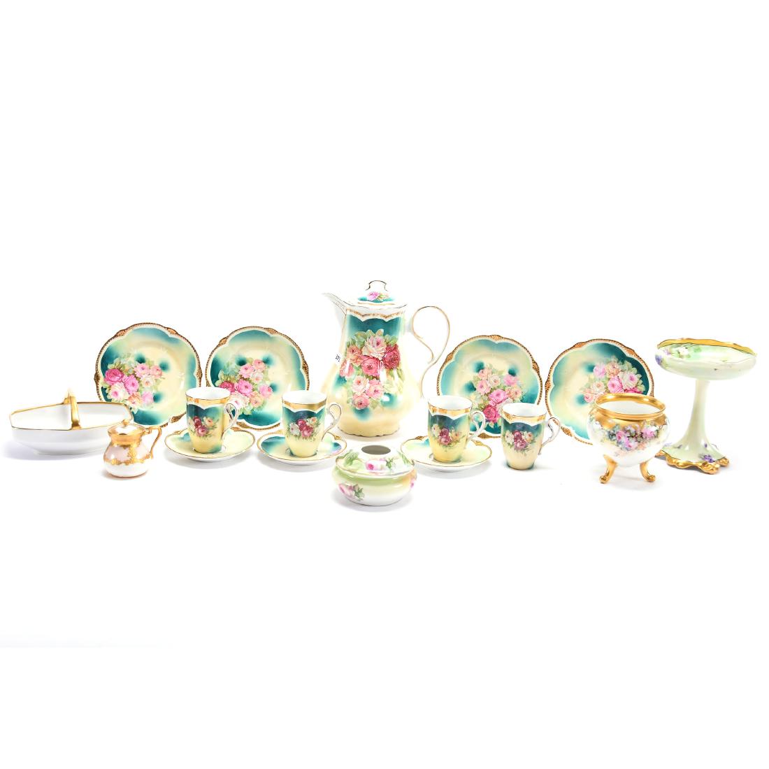 (14) Piece Floral Grouping, Floral Decor: (14) Piece Floral Grouping with Floral Decor; (1) 8.5" Chocolate Pot, Unmarked; (4) Cups; (3) Saucers; (4) Dessert Plates; (1) 6" Limoges Compote by Pitkin & Brooks Studio; (1) 6" Bavaria Basket, Frui